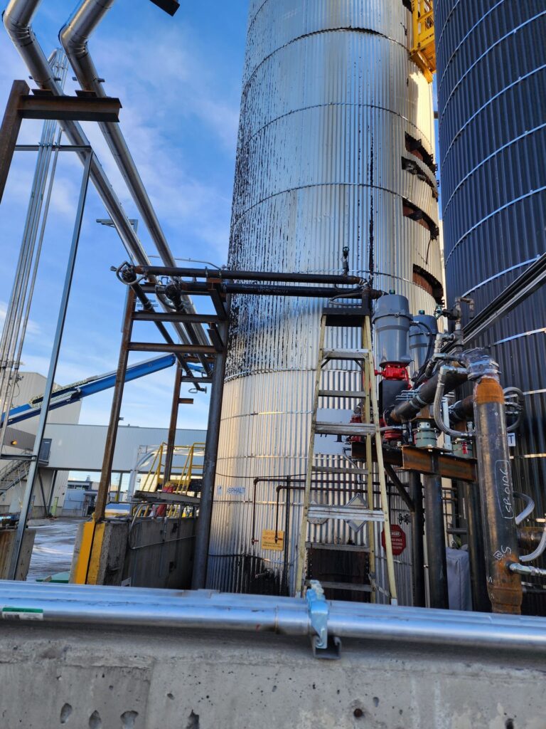 Outdoor industrial piping installation at an Alberta plant