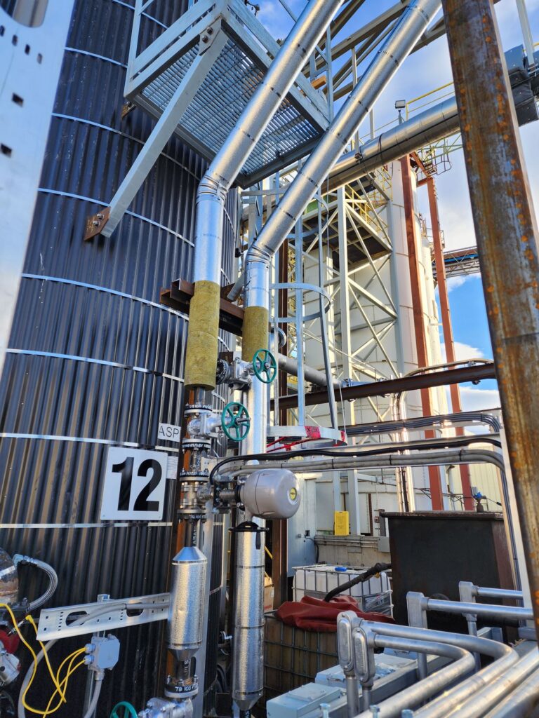 Industrial facility pipe rack and insulated piping