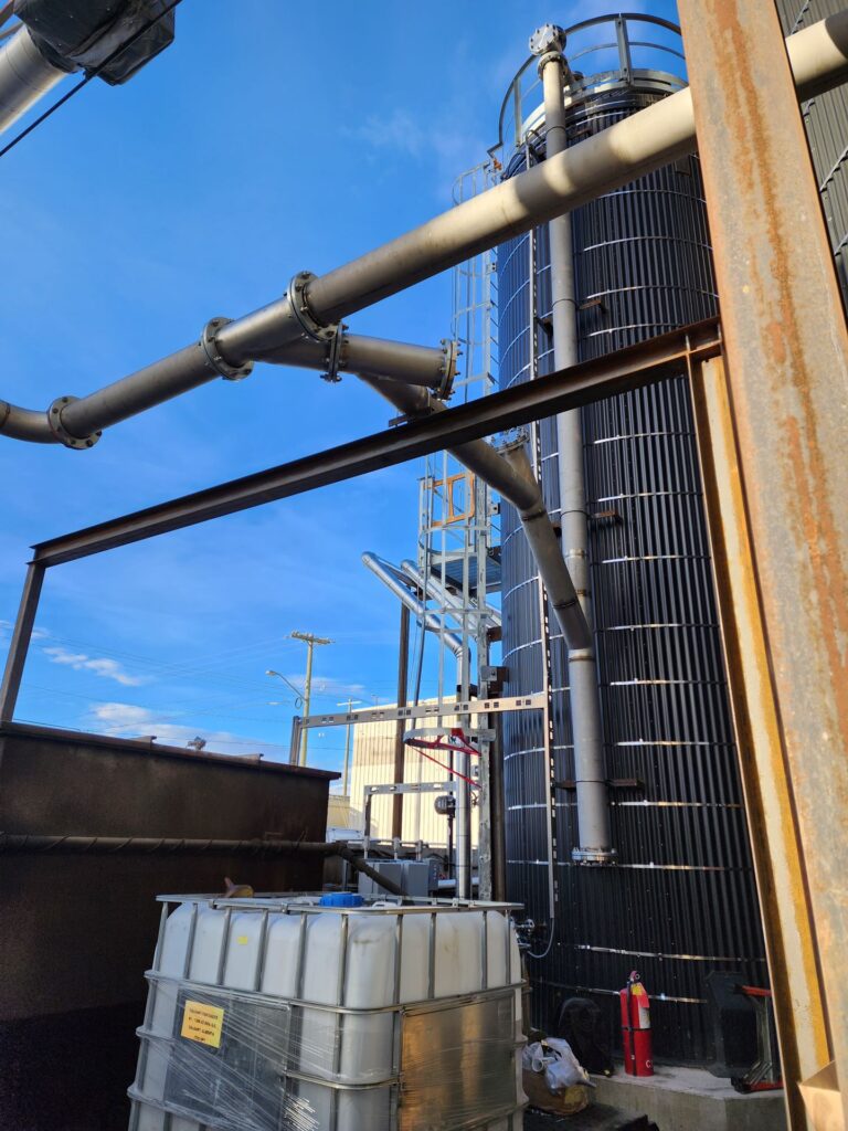 Overhead industrial piping at a processing plant