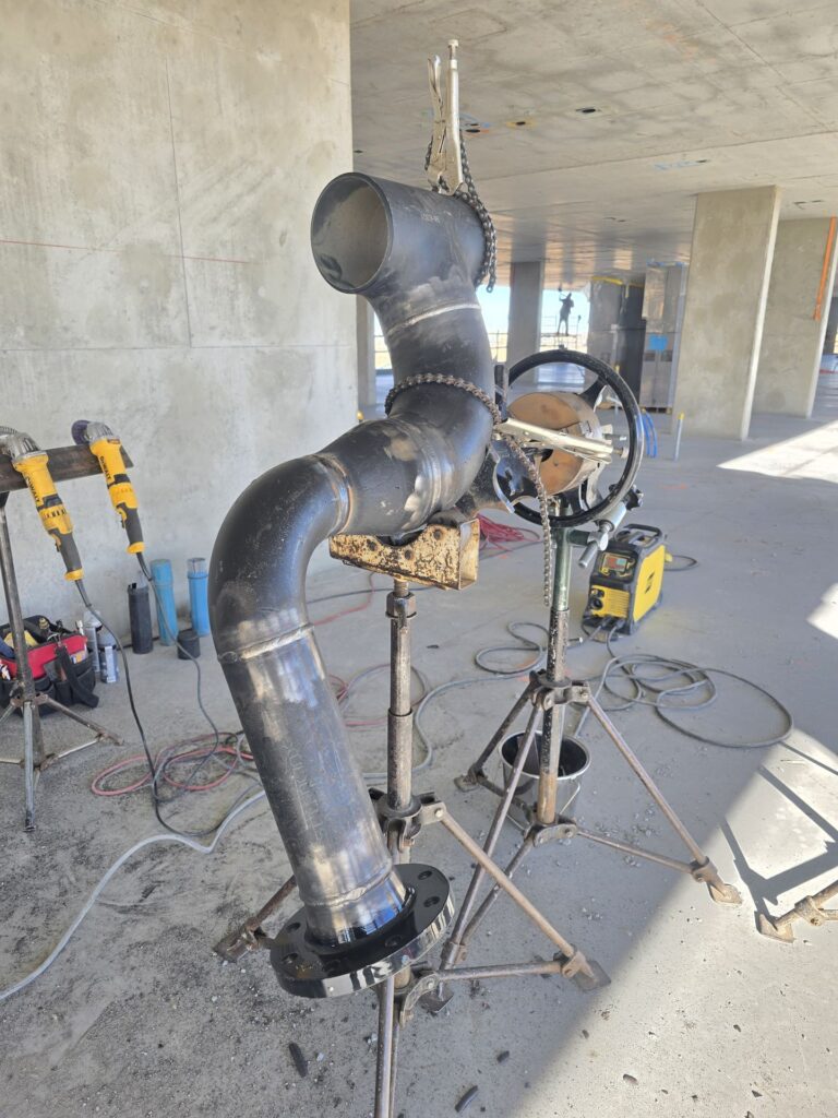 Large bore pipe spool welded on fabrication stands