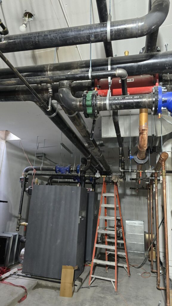 Mechanical room piping with pumps and valves installed