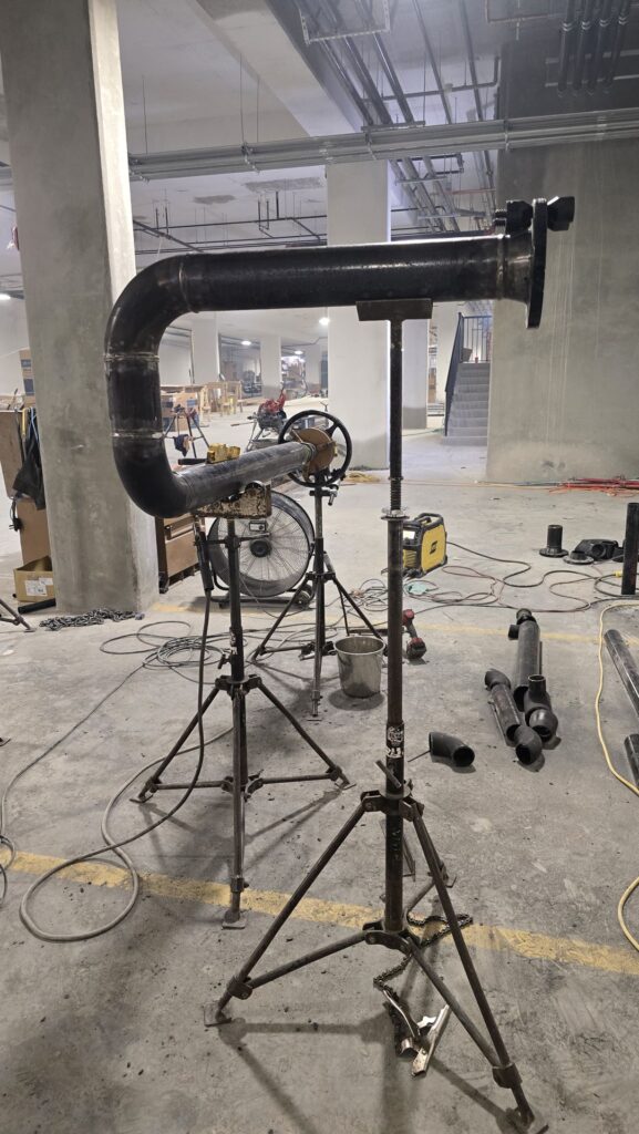On-site pipe fabrication in a parkade, Calgary