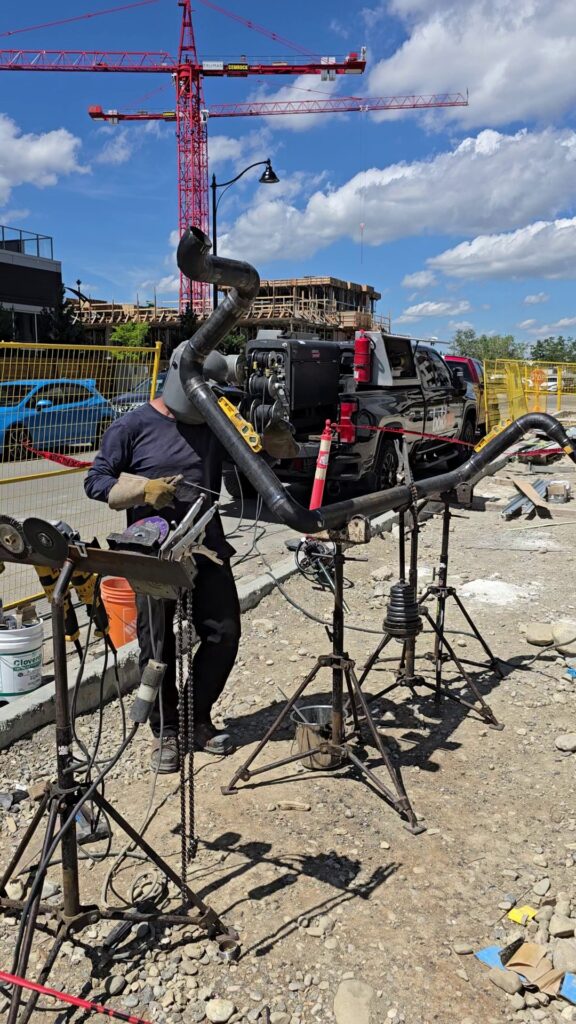 BoldArc welder working on pipe at a Calgary construction site